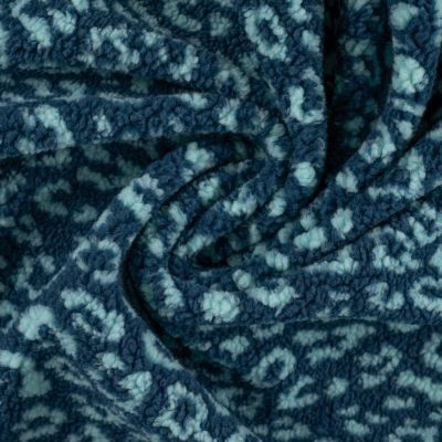 Tissu Teddy Bouclettes motif léopard Bleu ciel sur fond Bleu - Par 10 cm