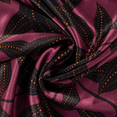 Tissu Viscose Satiné imprimé feuillage Noir et points Orange sur fond Lie de vin - Par 10 cm