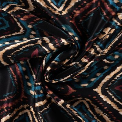 Tissu Viscose Satiné imprimé patchwork ethnique Turquoise sur fond Noir - Par 10 cm