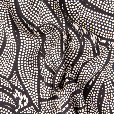 Tissu Viscose Twill EcoVero feuilles en pointillés sur fond Noir - Par 10 cm