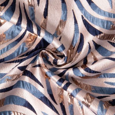 Tissu Jacquard d&#039;habillement Palmeraie brillant Or et Bleu sur fond Naturel - Par 10 cm