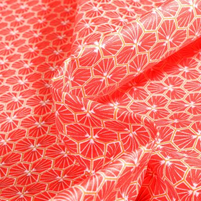 Tissu Coton imprimé riad sur fond Grenad - Par 10 cm