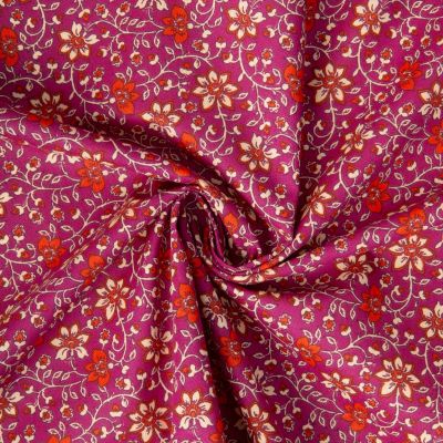 Tissu Coton imprimé Arty Goa fleuris sur fond Bordeaux - Par 10 cm