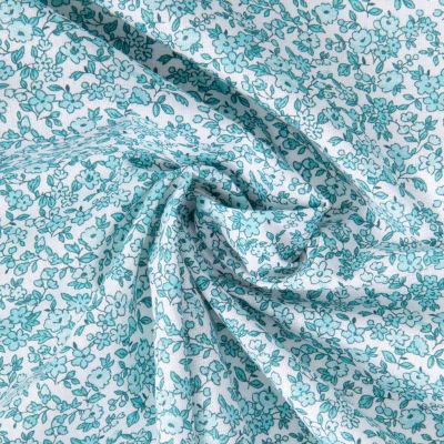 Tissu Coton Enduit Fleuris Léonie menthe et bleu sur fond Blanc - Par 10 cm