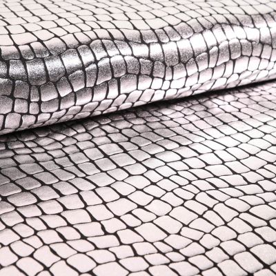 Tissu Jersey Métallisé Ecailles de crocodile argentées - Par 10 cm