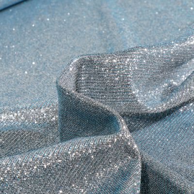 Tissu Jersey Lurex Pailleté sur fond Givre reflets bleus - Par 10 cm
