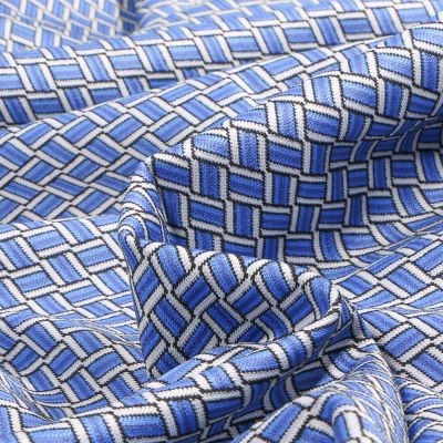 Tissu  Maille Jacquard Zig zag  sur fond Bleu - Par 10 cm
