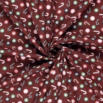 Tissu Coton imprimé Candy sucrerie de Noël sur fond Marron - Par 10 cm