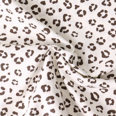 Tissu Popeline de Coton  panthère Isis sur fond Beige clair - Par 10 cm