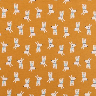 Tissu Jersey Coton Arty Lapins d&#039;Hiver Ecrus sur fond Moutarde - Par 10 cm