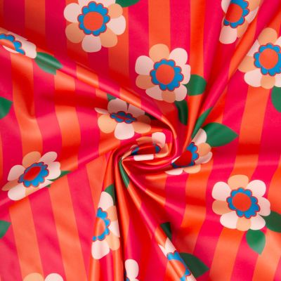 Tissu Imperméable imprimé Aliny rayé orange et fleuris sur fond Rose fuchsia - Par 10 cm