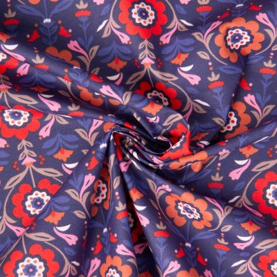 Tissu Coton Enduit Reine fleuris rouge sur fond Bleu foncé - Par 10 cm