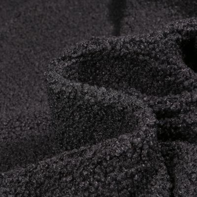 Tissu Fausse fourrure Teddy Bouclettes sur fond Noir - Par 10 cm