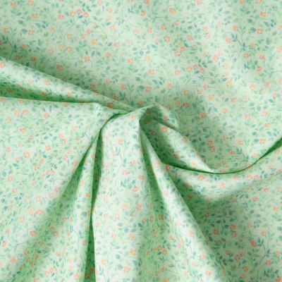 Tissu Popeline de Coton légère Fleur vert moyen et rose pêche sur fond Vert menthe clair - Par 10 cm