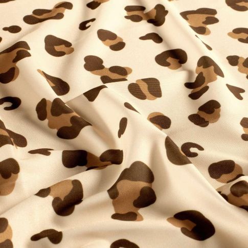 Coupon Tissu Lycra maillot de bain léopard Kaya sur fond Beige sable - Coupon de 100 cm