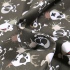 Tissu Coton MC Fabrics Têtes de mort énervés sur fond Vert kaki