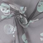 Tissu Tulle souple  Morgana tête de mort paillettes argentés et irisés sur fond Noir