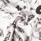 Tissu Viscose imprimé Lio perruches et cigognes Noir sur fond Blanc