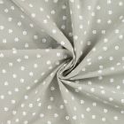 Tissu Popeline de Coton  patounes blanches  Zumi sur fond Vert kaki clair