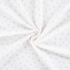 Tissu Popeline de Coton  patounes taupes Zumi sur fond Blanc cassé