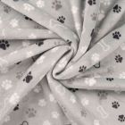 Tissu Doudou imprimé Patte de chien et os sur fond Gris clair