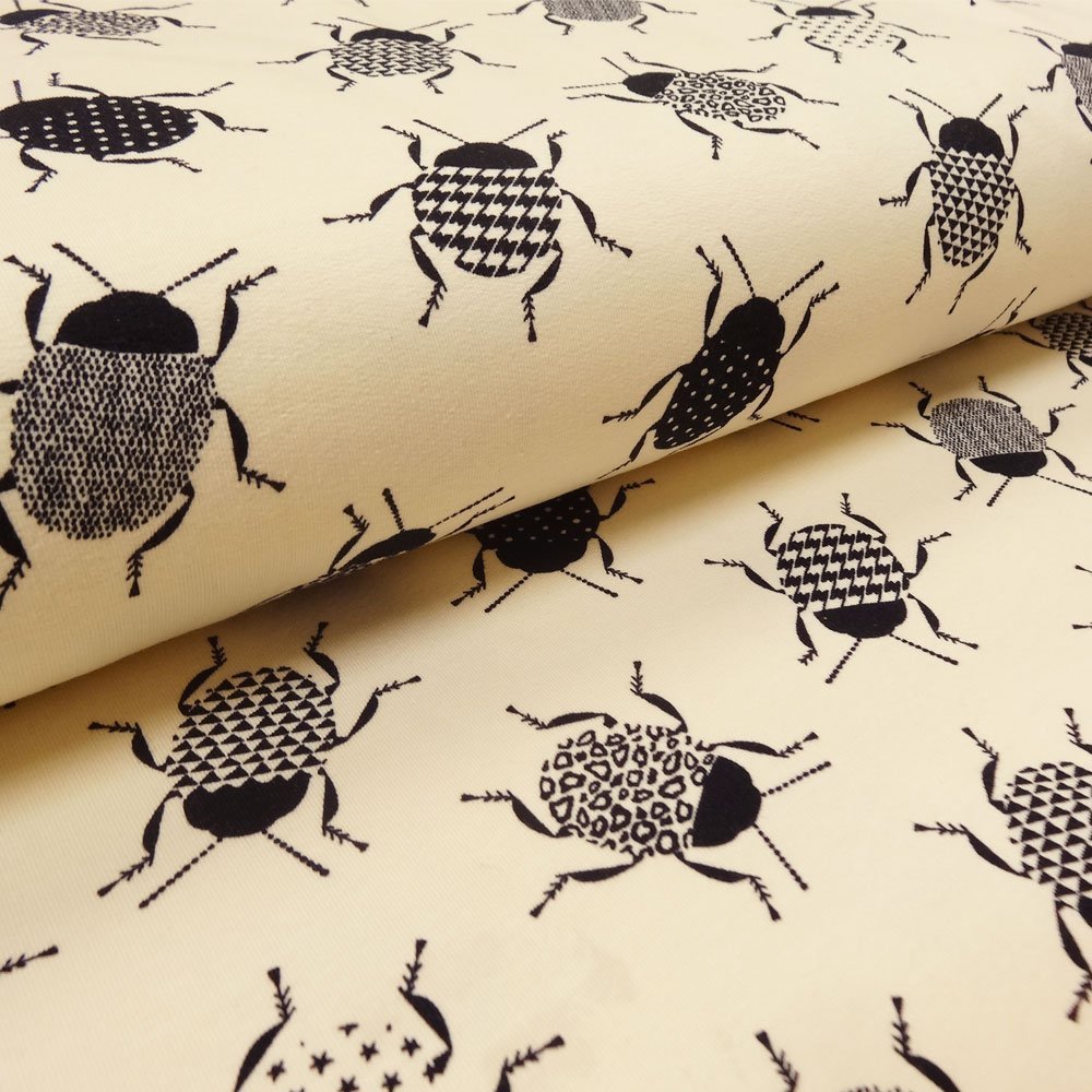 Tissu Jersey Coton Ecru scarabés noirs