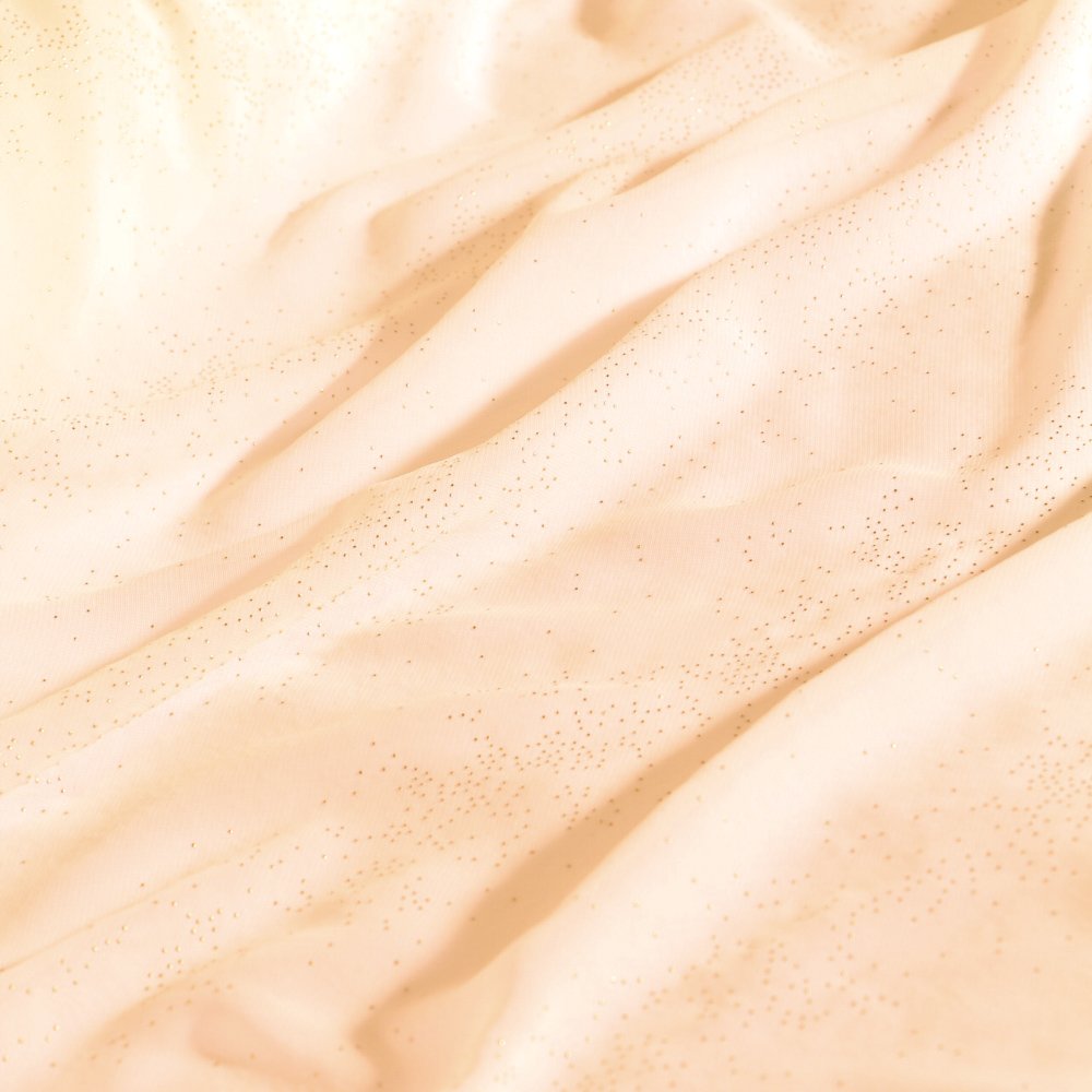 Tissu Mousseline Etincelles Or sur fond Ecru