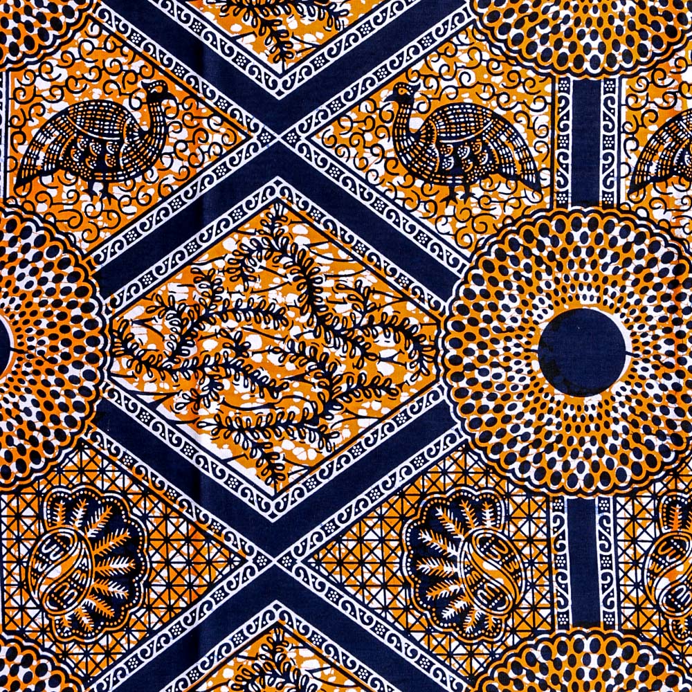 Tissu Wax Africain N°286 Losanges et Rosaces Bleu marine et blancs sur fond Orange et blanc