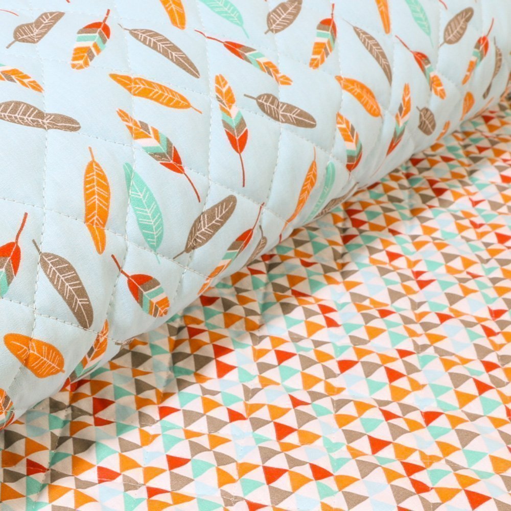 Tissu Matelassé Bleu ciel avec des plumes oranges