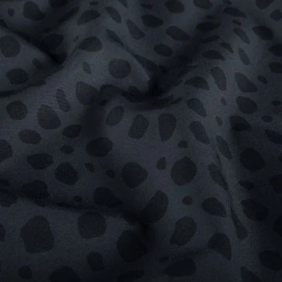 Tissu Softshell  Naya léopard Noir sur fond Gris - Par 10 cm
