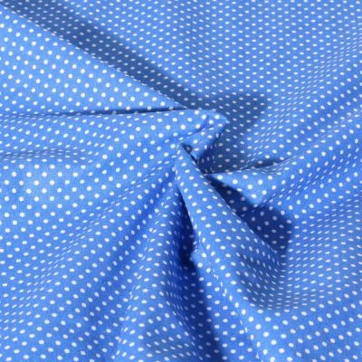 Tissu Popeline de Coton  Carmella à pois blanc sur fond Bleu azur - Par 10 cm