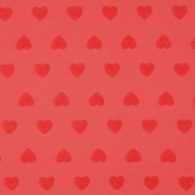 Tissu Maille cœur en éponge Amoria rouge sur fond Rouge - Par 10 cm