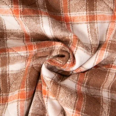 Tissu Matelassé Ciarra tout doux  envers doudoune carreaux Oranges et Bruns sur fond Beige - Par 10 cm