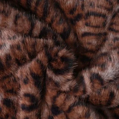 Tissu Fausse fourrure Léna motif panthère Noir sur fond Marron chocolat - Par 10 cm