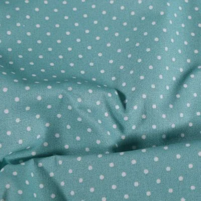 Tissu Coton enduit Petits pois blancs sur fond vert d&#039;eau - Par 10 cm