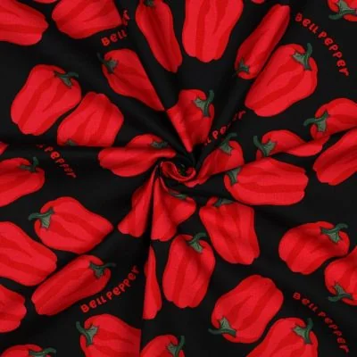 Tissu Toile de Coton Canvas Poivrons rouges sur fond Noir - Par 10 cm
