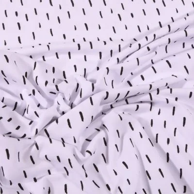 Tissu Jersey Coton Bio Pointillés noirs sur fond Blanc - Par 10 cm
