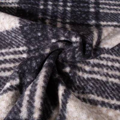 Tissu Bouclette Polyester Carreaux sur fond Noir - Par 10 cm