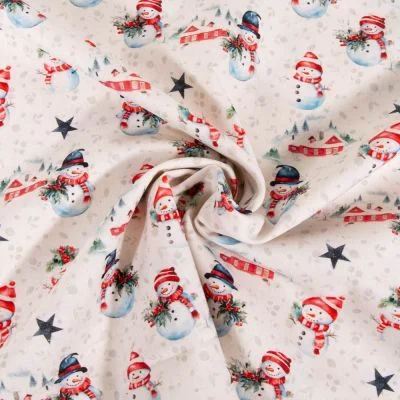 Tissu Coton imprimé Bonhomme de Noël sur fond Ecru - Par 10 cm