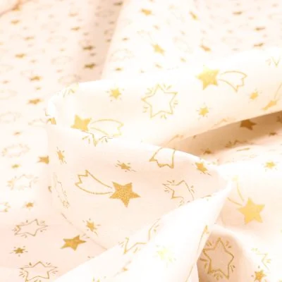 Tissu Coton imprimé Bio Etoiles filantes dorées sur fond Blanc cassé - Par 10 cm