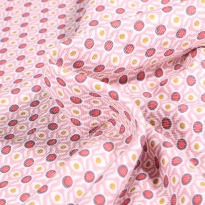 Tissu Jersey Coton Bio Alvéoles et pois sur fond Rose pâle - Par 10 cm