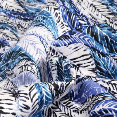 Tissu Coton Satiné extensible Palmeraies blue sur fond Blanc - Par 10 cm