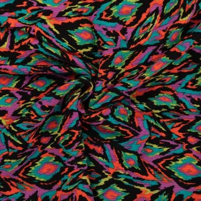 Tissu Crépon Viscose Momo coloré sur fond Noir - Par 10 cm