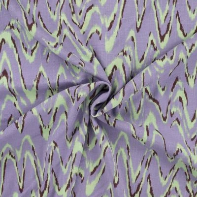 Tissu Viscose aspect Lin Waves vert menthe sur fond Lilas - Par 10 cm