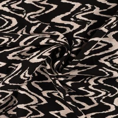 Tissu Viscose aspect Lin Waves beige sur fond Noir - Par 10 cm