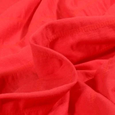 Tissu Jersey Coton smocké uni Rouge - Par 10 cm
