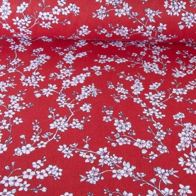 Tissu Coton imprimé Fleur d&#039;amandier sur fond Rouge - Par 10 cm
