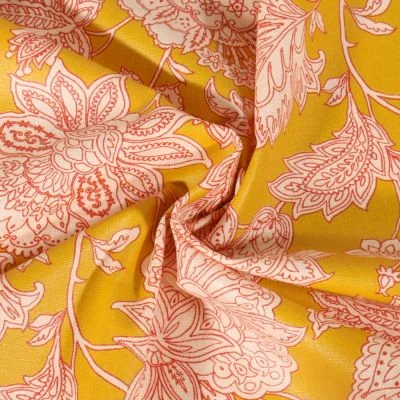 Tissu Coton enduit Sharma fleuris sur fond Jaune curry - Par 10 cm