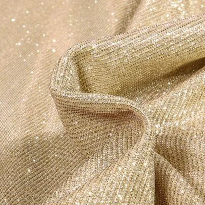 Tissu Jersey Lurex Pailleté sur fond Or - Par 10 cm