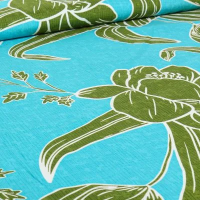 Tissu Viscose Hawa vert sur fond Bleu turquoise - Par 10 cm